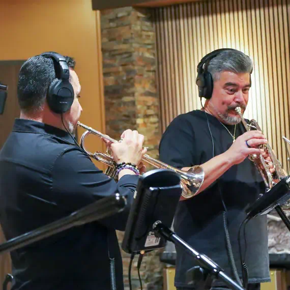 Musicians recording music in a renowned Houston studio